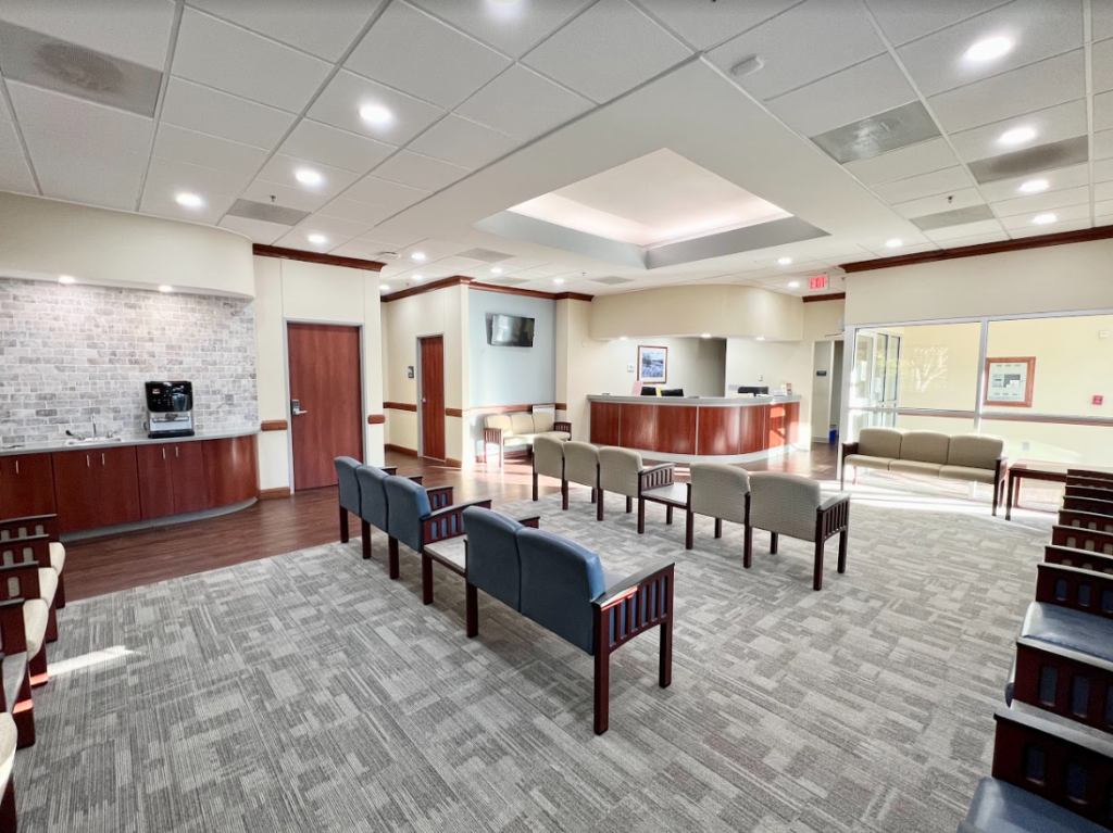 Healthcare waiting room with wood accents and pendant lighting